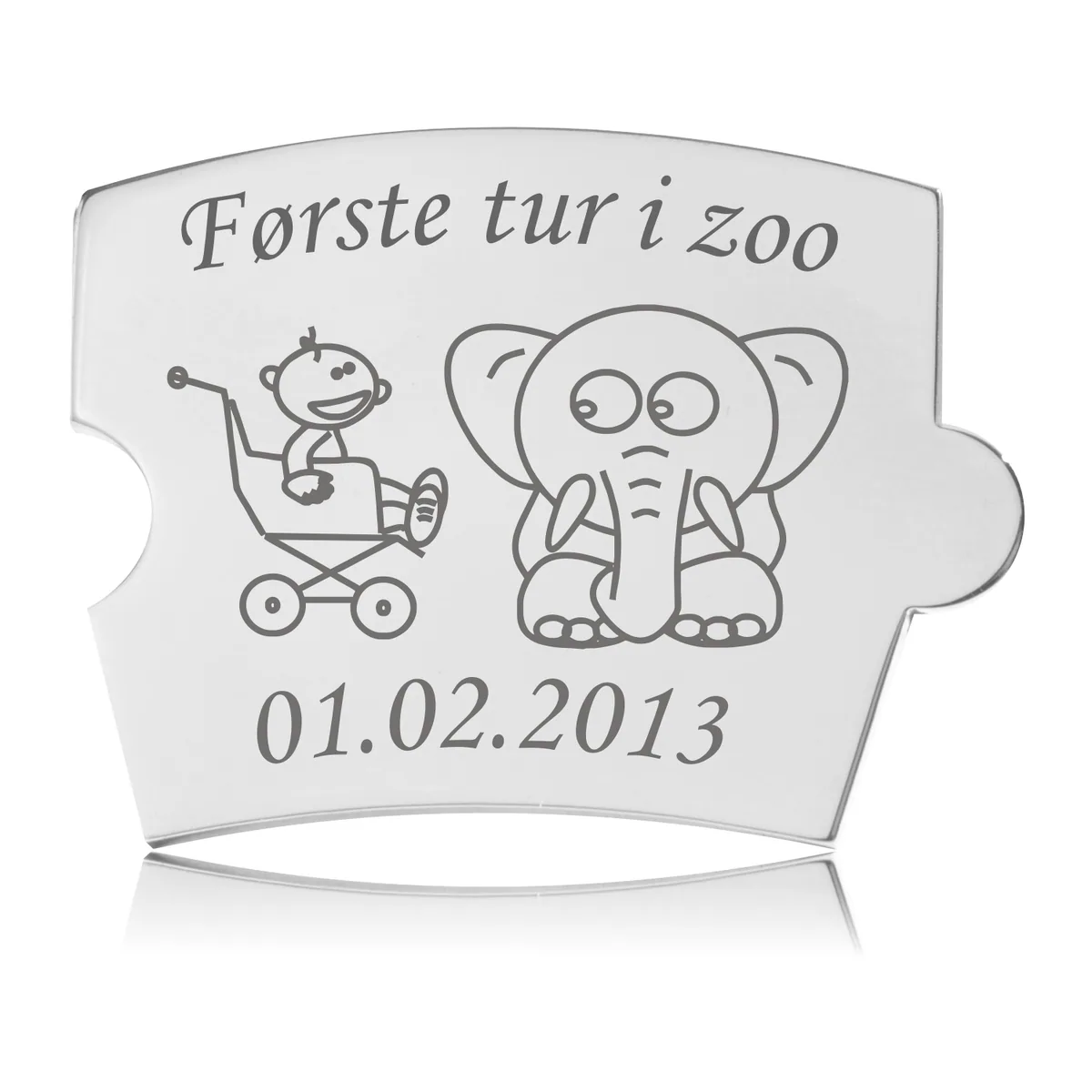 Memozz Spin brik 'Første tur i zoo' med gravering af en elefant og en baby i en barnevogn i poleret stål.