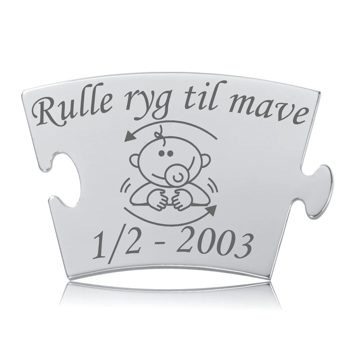Memozz Classic brik i rustfrit stål med teksten "Rulle ryg til mave" og et motiv af en baby med sut