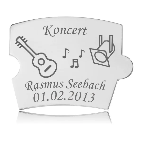 Memozz Spin Koncert brik i hårdtpoleret rustfrit stål med graverede billeder af guitar, nodetegn og scenelys spot