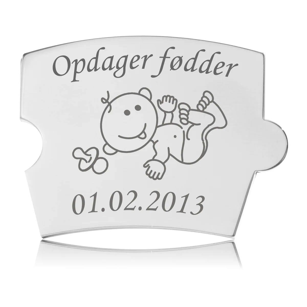 Memozz Spin brik i håndpoleret rustfrit stål, graveret med en glad baby og teksten "Opdager fødder".