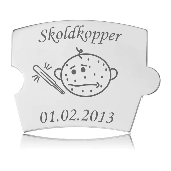 Memozz Spin brik med "Skoldkopper" indgravering, motiv af barn med prikker og termometer på reflekterende stål.