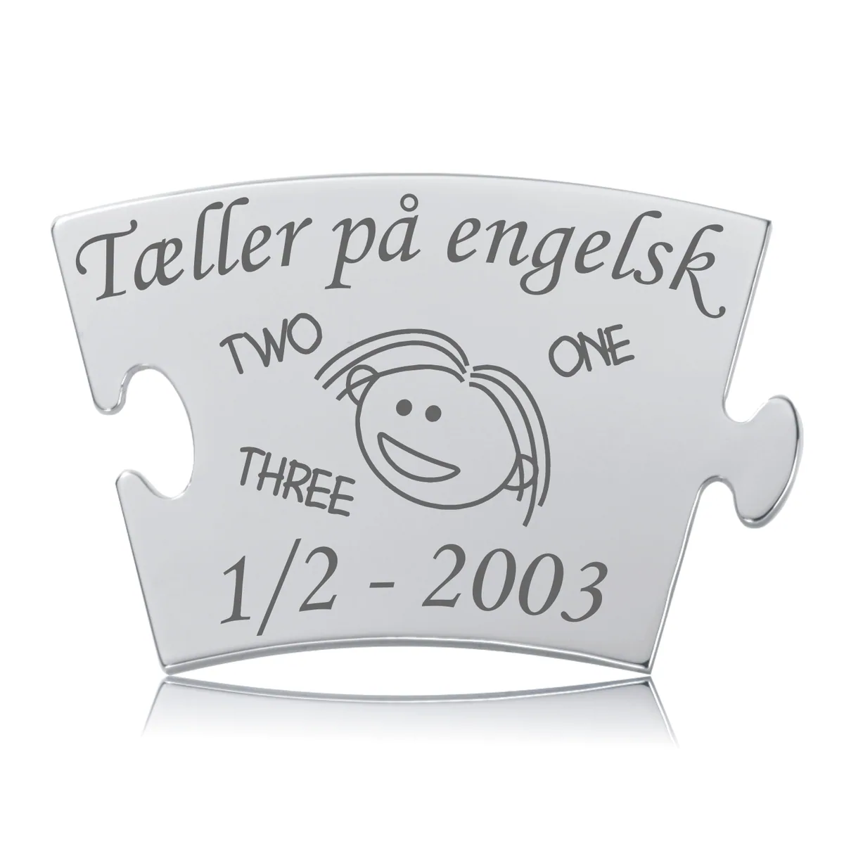 Memozz Classic brik "Tæller på engelsk - Pige" i blankt stål med mørk lasergravering showing "Tæller på engelsk" og "ONE, TWO, THREE".