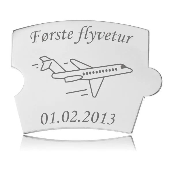 Memozz Spin mindebrik "Første flyvetur" i skinnende rustfrit stål med graveret flymotiv