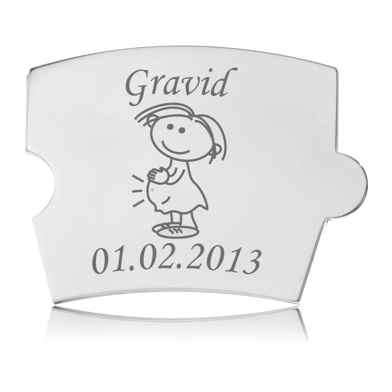 Memozz Spin mindebrik "Gravid - Model Mor" i blankt, håndpoleret rustfrit stål med lasergraveret gravid kvinde figur og ordet "Gravid".