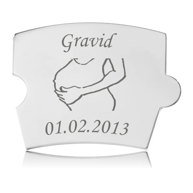 Memozz Spin Gravid Mave brik i håndpoleret rustfrit stål med lasergravering af "Gravid" og kontur af kvindemave