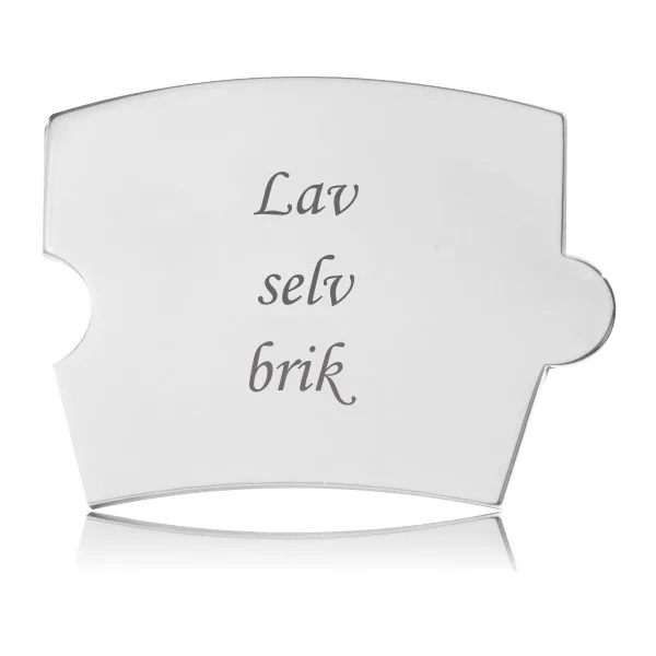 Blank Memozz Spin lav-selv brik i rustfrit stål med teksten "Lav selv brik" graveret i elegant kursiv skrift