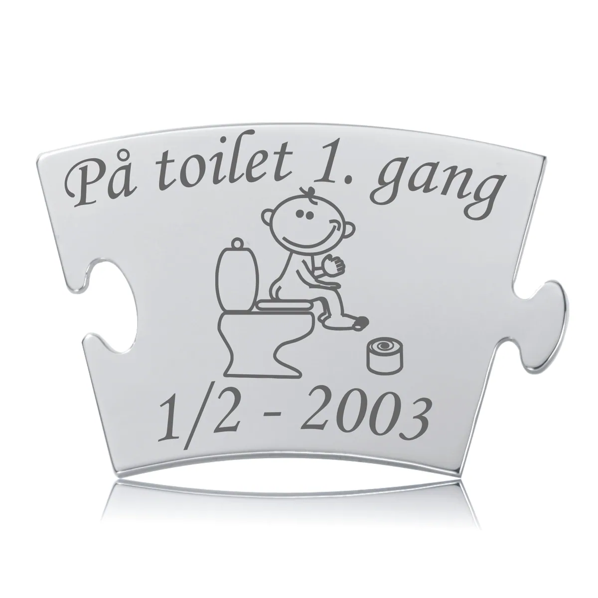 Memozz Classic brik "På toilet 1. gang" i blankt rustfrit stål med mørk lasergravering af barn på toilet.